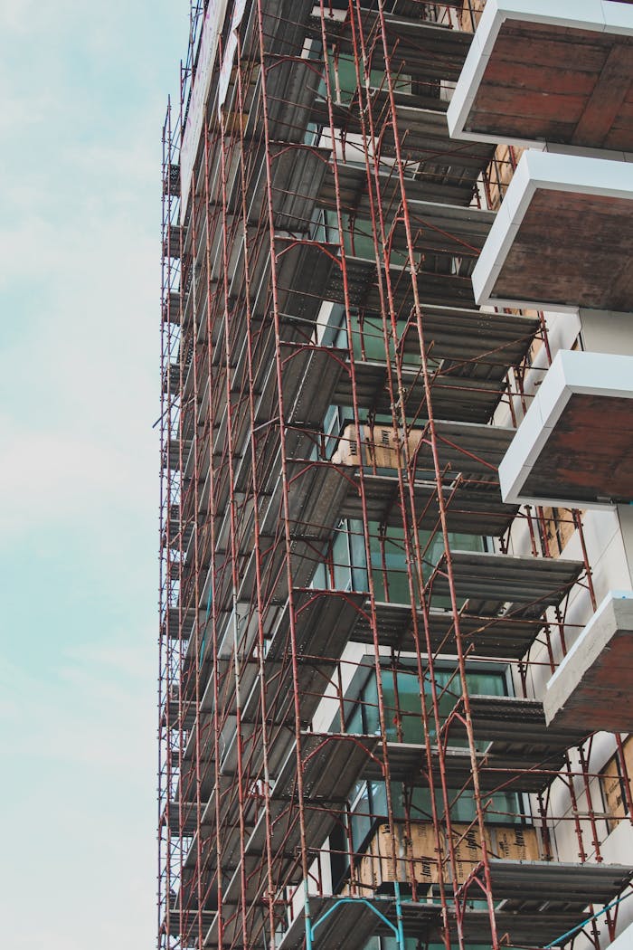 High-rise building in Berlin under construction with visible scaffolding.